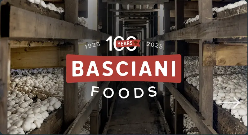 Basciani Foods 100 years logo over the mushroom growing house